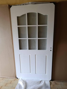 White hardwood Kithcen to dining glass door