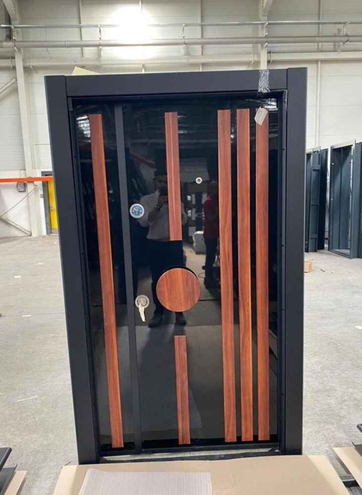 Turkish Security Door with a modern design with a black finish and vertical wooden accents