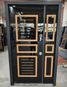 Modern black security Door with wooden trim and gold accents likely of turkish origin