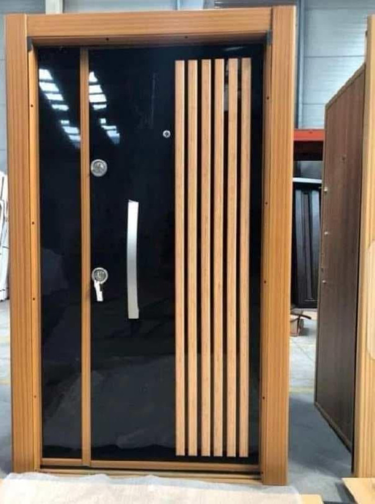 Modern Turkish Security Door with a black high-gloss finish and a light wood-effect frame and vertical accents