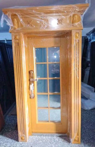 This is a french glass door with a wooden frame and architraves suitable for interior or exterior use