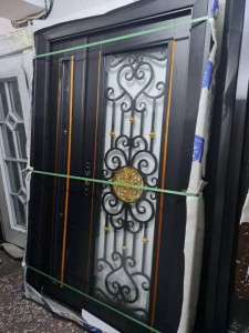 Heavy-duty wrought Iron security Door with a disctive black finish and gold accents