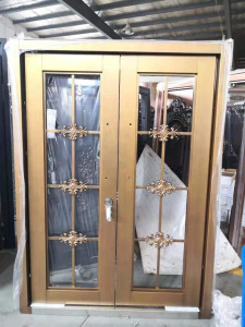 gold-toned aluminum-framed sliding glass door with decorative grillies