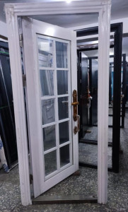 this is a golden-coloured aluminum Security Door with decorative glass panels