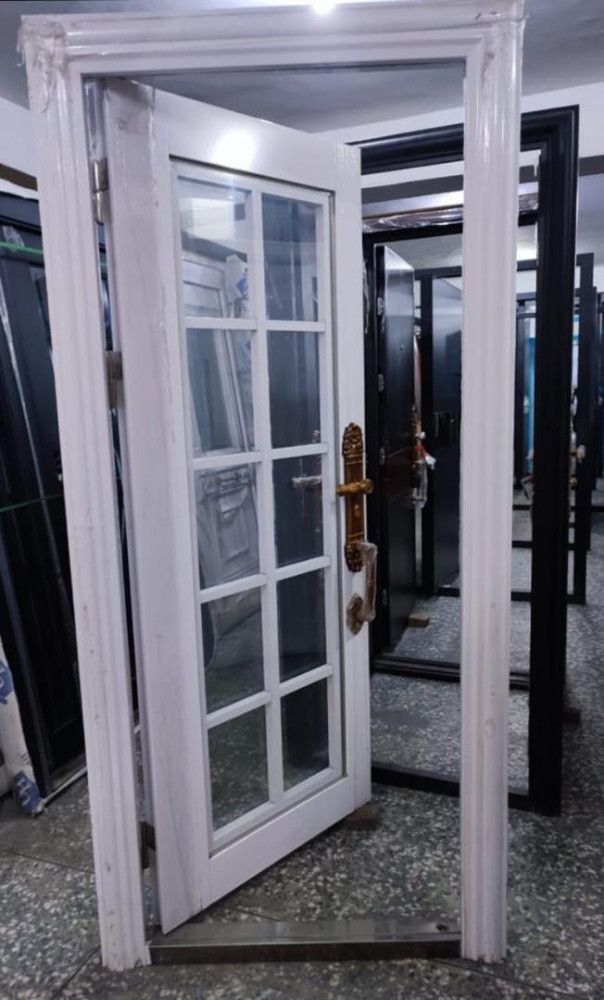 this is a golden-coloured aluminum Security Door with decorative glass panels