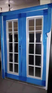 This is a double -glazed UPVC french window or door with a decorative bar design