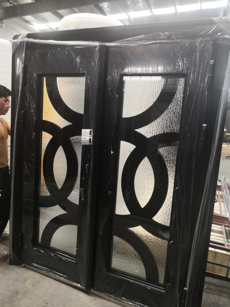 This is duble-entry wrought iron door with contemporary circular design 