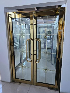 Gold-framed glass entrance door