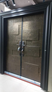 Modern-style, double-leaf steel Security door with textured, metallic finish