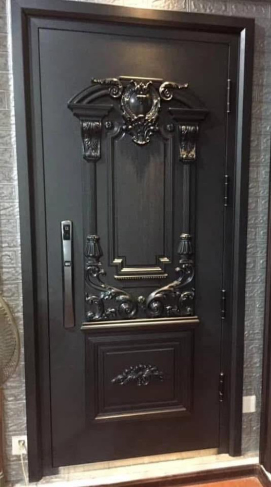 This is a black cast metal security Door