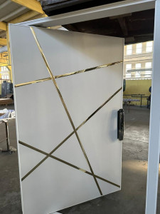 this is modern White door with Gold metal inlay accents