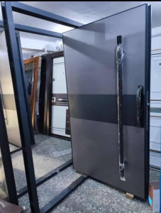 This is a modern grey and black steel Security Door