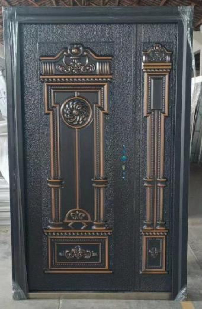 Cast Aluminum Steel Security Door with a decorative design and a black and copper finish