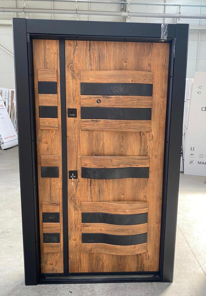Modern turkish steel Security door featuring a wood-panel aethetic with stainless steel accents
