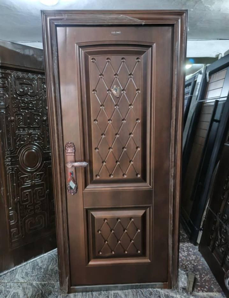 Modern laminated High Density Fibreboard(HDF) interior wooden room door featuring horizontal gold-coloured metalic inlays