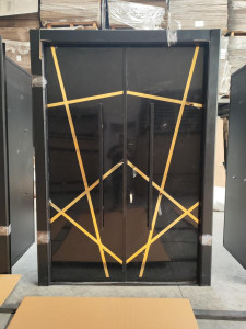 Luxury security door with a black and gold geometric design