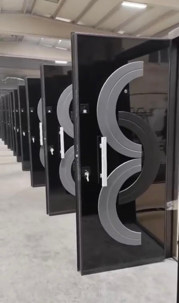 Turkish Security Door featuring a sleek black finish and a prominent arched handle design