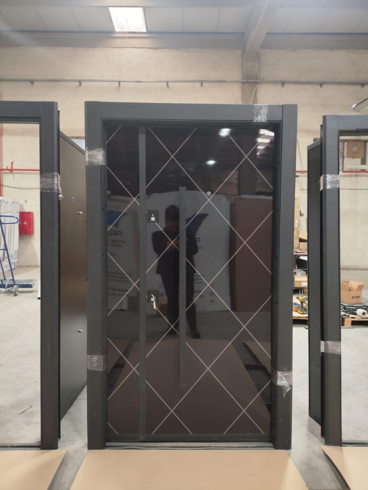 Modern Turkish-style Security Entrance door featuring a dark steel frame and a dark glass panl with a white diamond patterned grid design