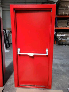 Red fire-rated Exit Door equipped with a panic bar for emergency egress