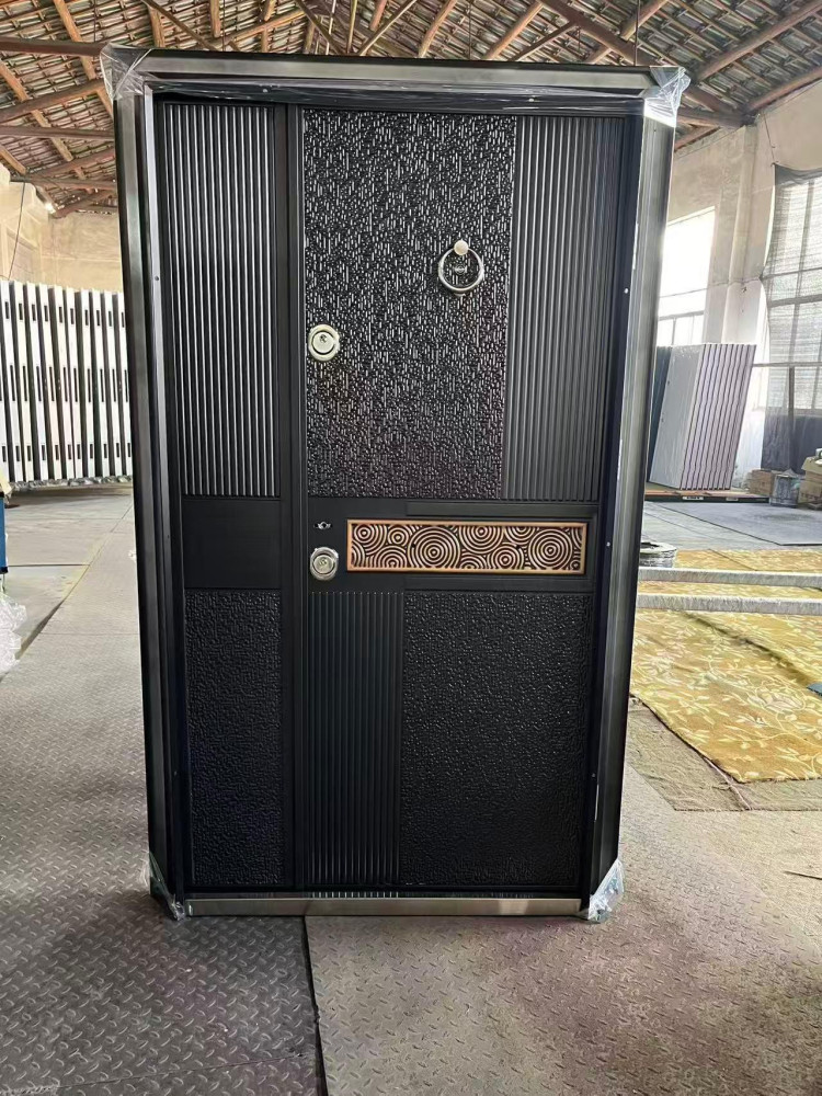 Modern metal security doorfeaturing a decorative textured panel, vertical ribbed sections nd a geometric patttern inlay