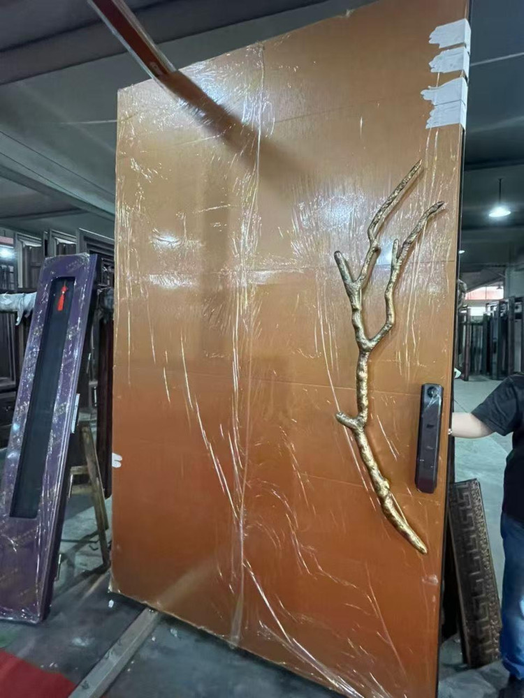 Decorative door featuring a custom branch-shaped handle designed by Philip Watts
