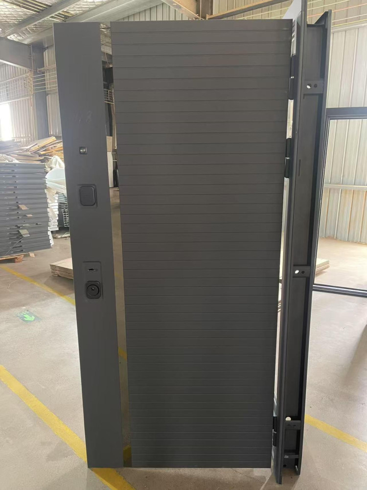 Modern, dark grey metal security Door featuring a unique vertical textured design