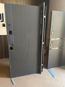 high-grade luxury front door featuring a modern ribbed design and multi-point locking mchanisms