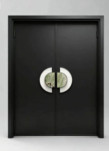 modern black double door featuring distinct circular stone handle