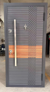 Turkish Steel Security Door featuring a modern grey design with a central vertical handle and a decorative wood panel accent