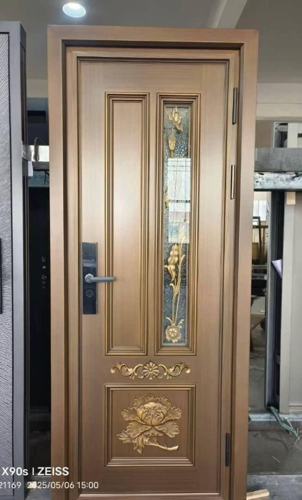 Decorative Security Steel Door featuring intricate flora castings and glass panel