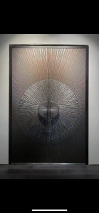 decorative door featuring a radial sunray pattern 