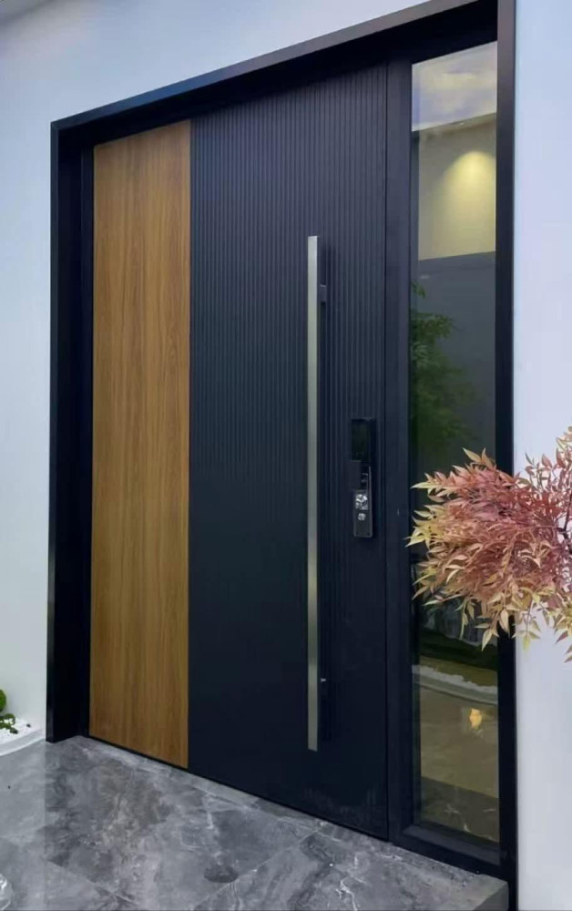 urban Townhouse aluminum metal entrance metal entry door features a modern, fluted black design paired with a wood-grain panel and a long vertical stainless steel handle