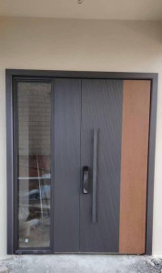 Modern Pivot entrance door features a smart lock and a glass side panel