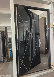 Modern Stainless Steel Pvot entry door with a black glass finish and silver line designs
