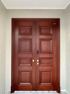 double wooden door appears to be a majestic entrance door crafted from premium seasoned teak or sheesham wood