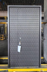 decorative stainless steel or Aluminum Composite Panel Security Door featuring a geometric cut pattern