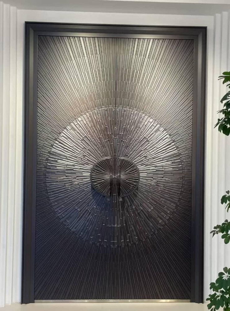 Modern double door featuring a textured metal finish in a sunbrust design, 