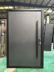 modern security or Exterior door featuring a textured 