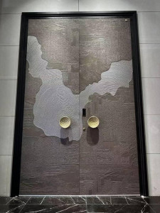 Modern, heavy-duty double door with a textured dark gray finish and a distinctive silver-coloured decorative inlay