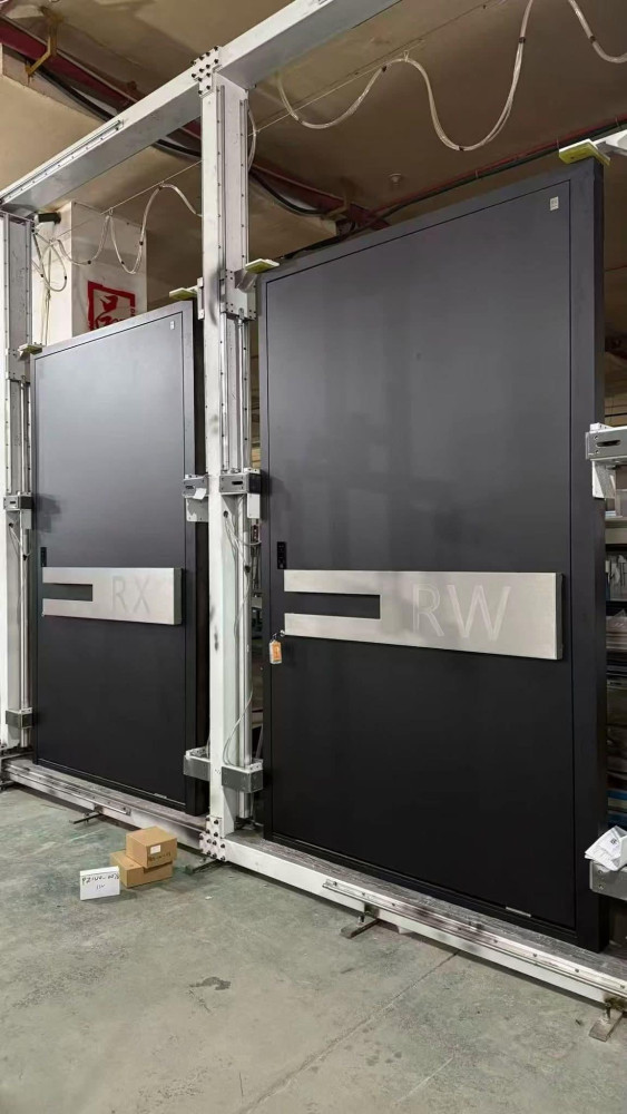 Two large, industrial-style black doors with metalic horizontal handles